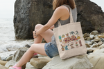 Load image into Gallery viewer, tote-bag-mockup-featuring-a-young-woman-sitting-on-a-rock-by-the-sea-109-el
