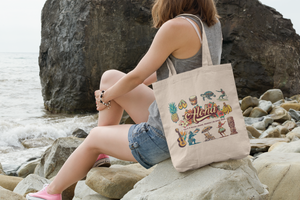 tote-bag-mockup-featuring-a-young-woman-sitting-on-a-rock-by-the-sea-109-el